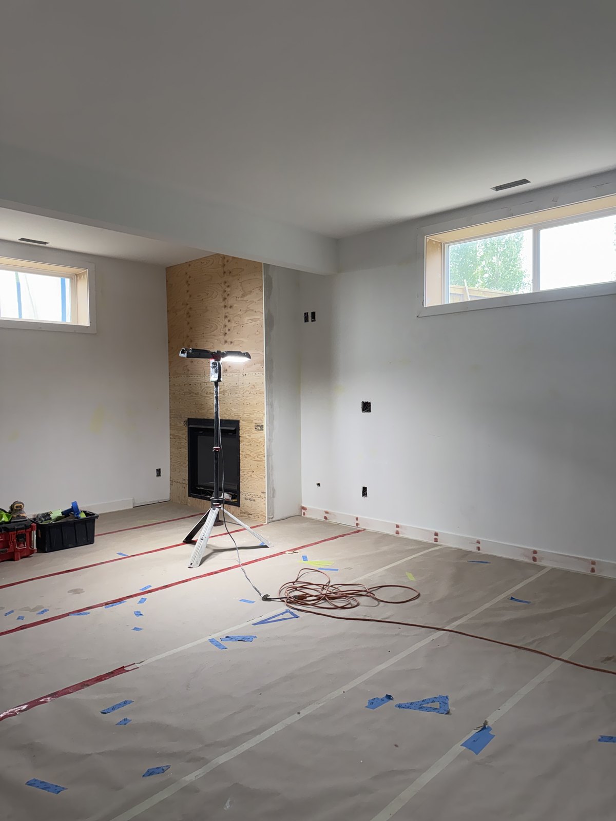 Basement Paint & Fireplace Progress by Barewalls Construction