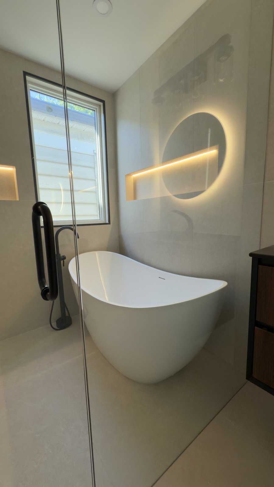 Freestanding Tub & Accent Lighting by Barewalls Construction