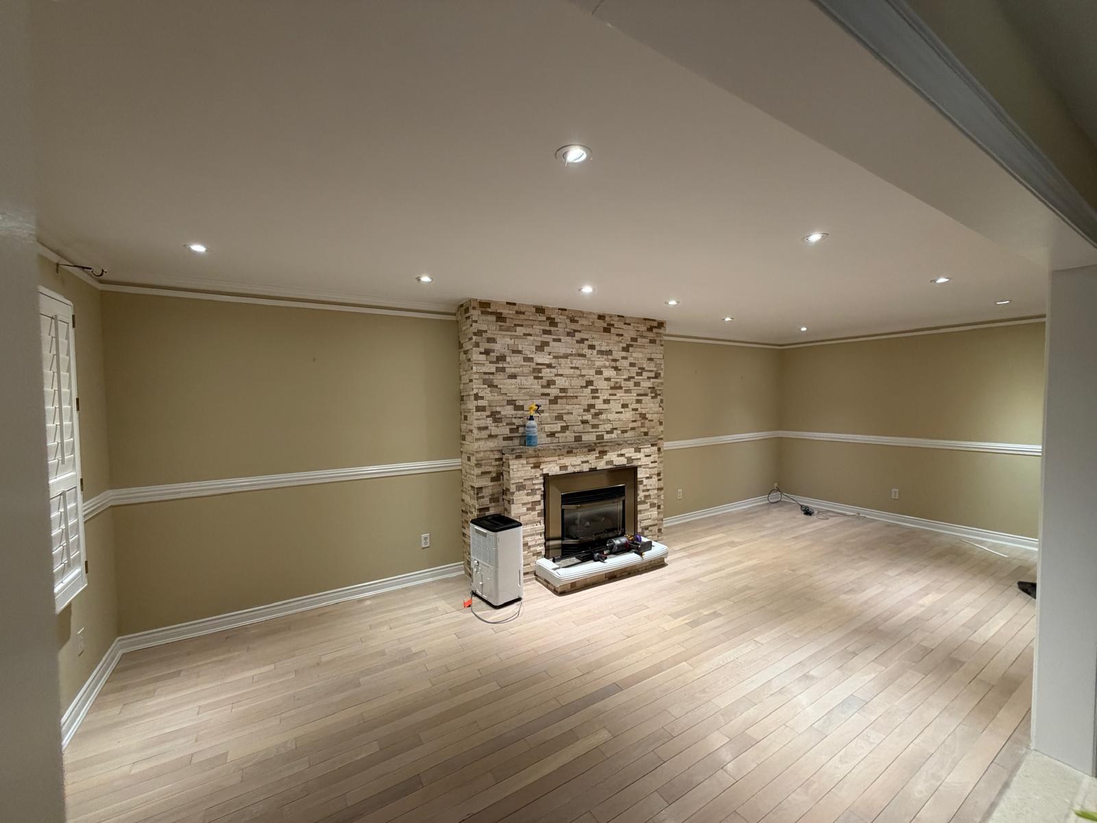 Living Room & Fireplace Finish by Barewalls Construction