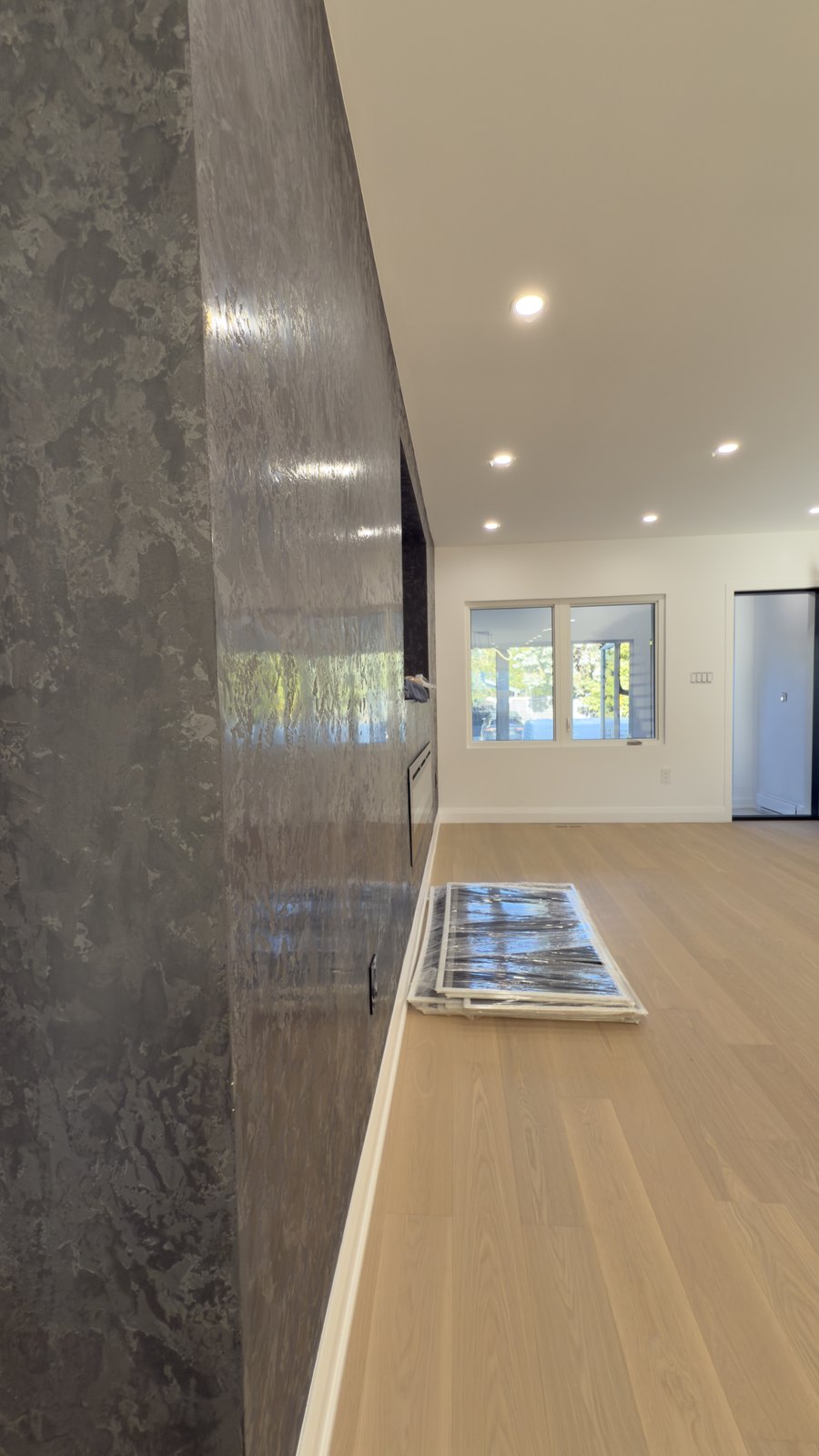 Open Kitchen & Living Space by Barewalls Construction