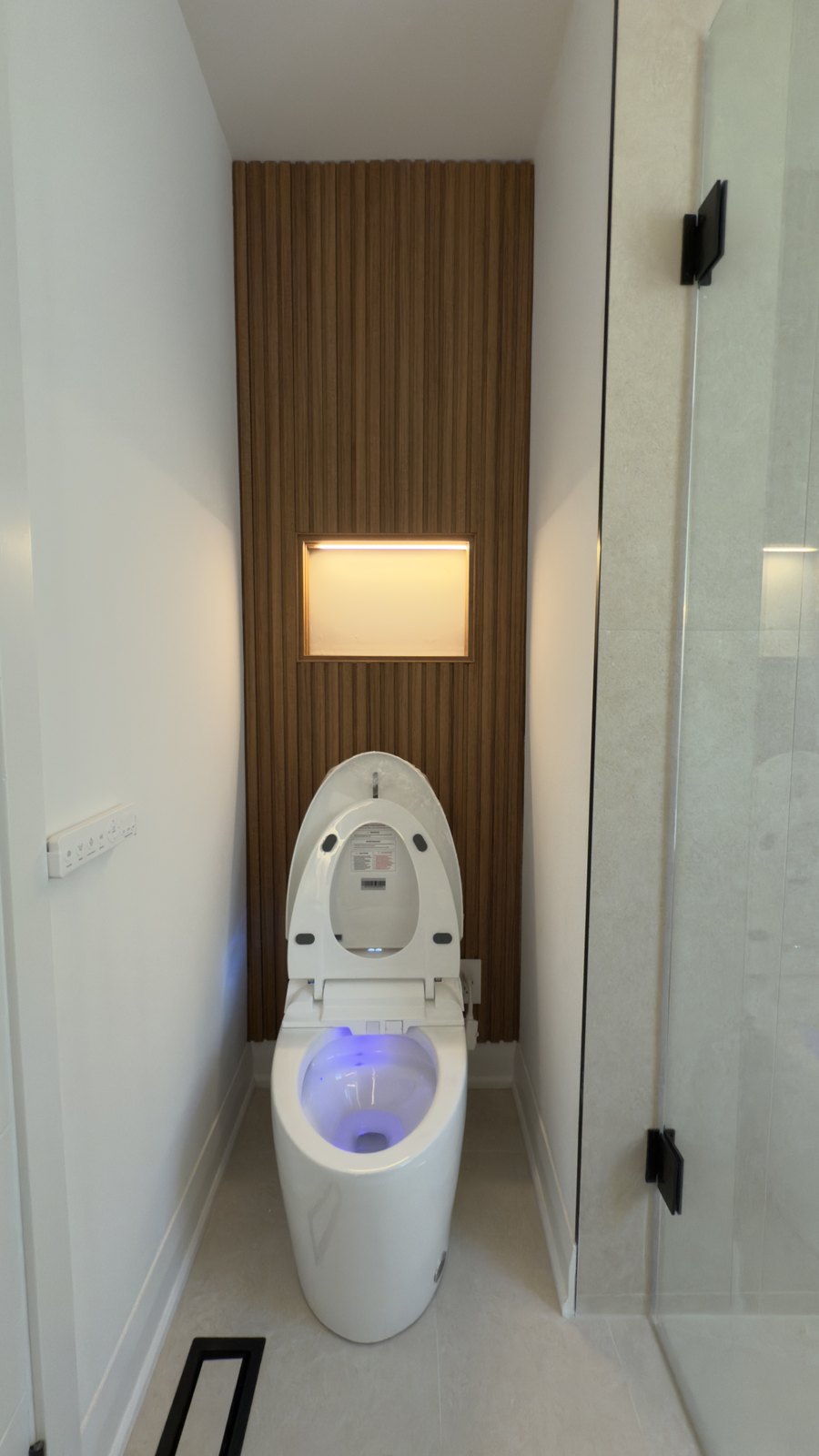 Modern Wood-Panel Washroom by Barewalls Construction
