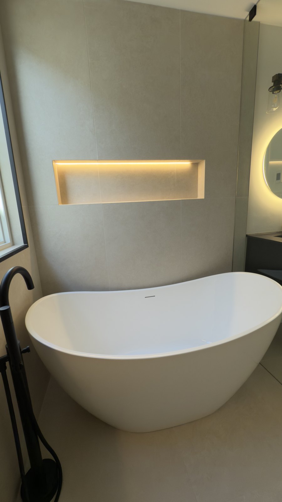 Freestanding Tub & Lit Niche by Barewalls Construction