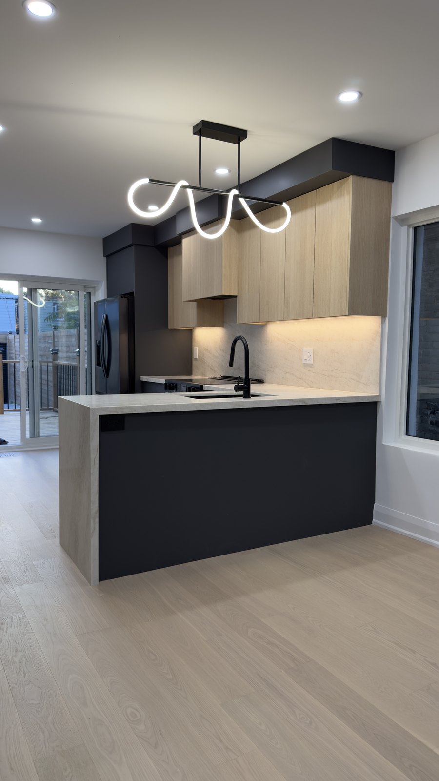 Modern Two-Tone Kitchen by Barewalls Construction